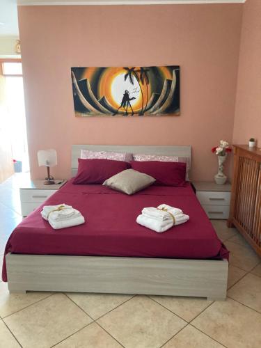 Een bed of bedden in een kamer bij L’Ulivo