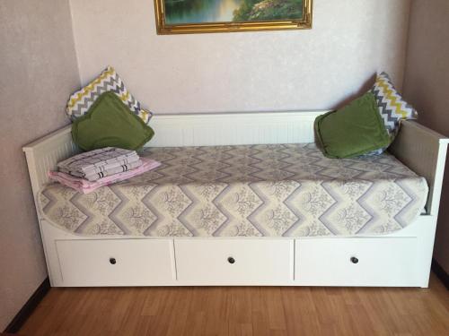 a bed with two pillows on it in a room at Апартаменты с прекрасным видом на море в Актау in Aktau
