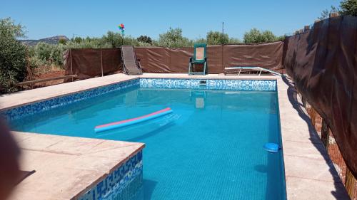 a large swimming pool with a brown tarp over it at Casita La Parchite in La Cimada