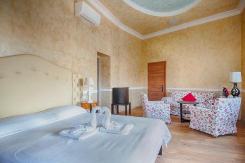 a bedroom with a bed with two swans on it at Lady Verona Residence in Verona
