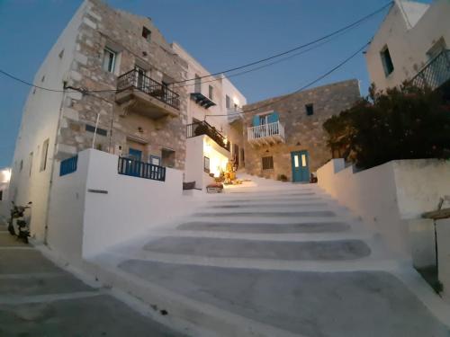 a view of a street in a town with white buildings at Popi Studios in Astypalaia Town