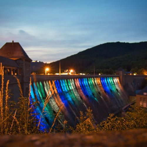 a large waterfall with colorful lights on it at night at Ferienwohnung Berges in Edersee
