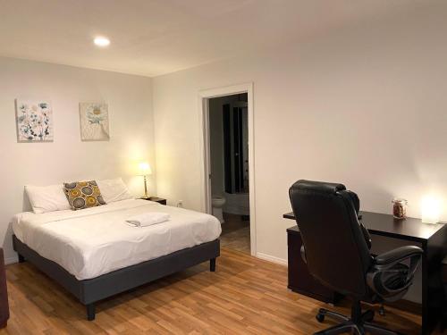 a bedroom with a bed and a desk and a chair at Alina & Fanny - Philadelphia Convention Center in Philadelphia
