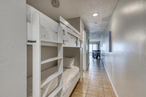a corridor with bunk beds in a apartment at Crystal Sands Condominiums in Destin