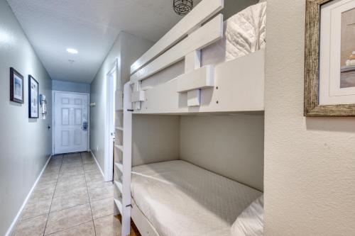 a room with white shelves and a hallway at Crystal Sands Condominiums in Destin