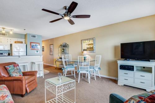 a living room with a couch and a flat screen tv at Crystal Sands III in Destin