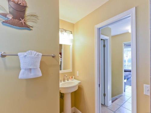 a bathroom with a sink and a mirror at Nantucket Rainbow Cottages in Destin