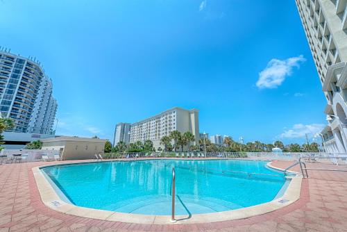 a large swimming pool with buildings in the background at Ariel Dunes I in Destin