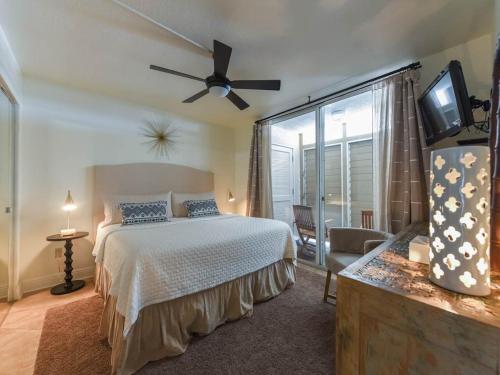 a bedroom with a bed and a ceiling fan at Magnolia House at Destin Pointe III in Destin