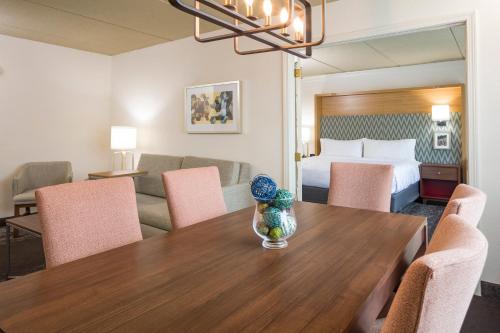 a hotel room with a table and a bed at Holiday Inn Salem by IHG in Salem