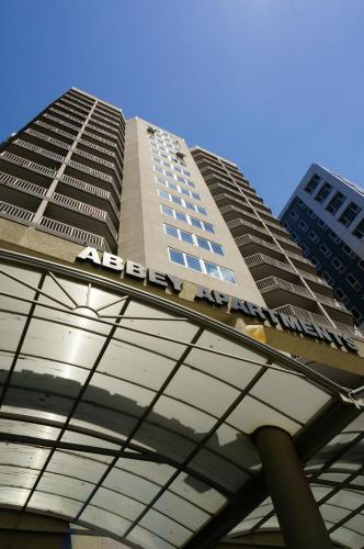 a building with a sign on top of it at Abbey On Roma Hotel & Apartments in Brisbane