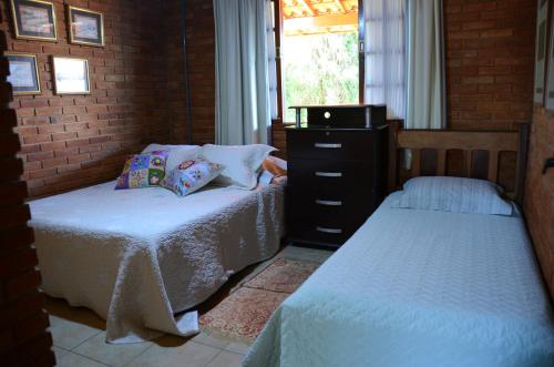 A bed or beds in a room at Casa em penedo