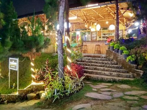 a set of stairs in a garden at night at Valle Verde Villas in Bandung