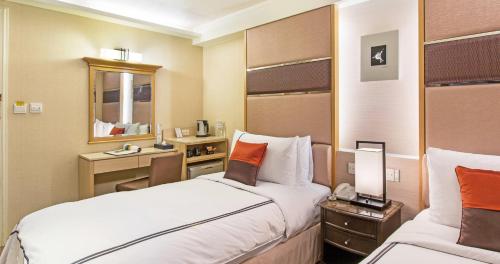 Postel nebo postele na pokoji v ubytování K Hotel Keelung