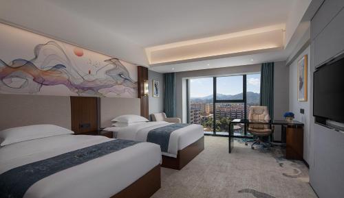 a hotel room with two beds and a large window at Ramada Encore by Wyndham Chenzhou North in Zixing