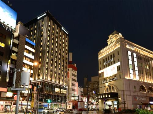 a city street with tall buildings at night at Asakusa Tobu Hotel in Tokyo