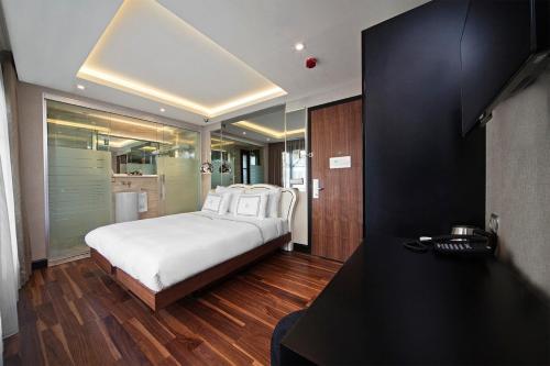 a bedroom with a large bed and a table at The Haze Karaköy in Istanbul