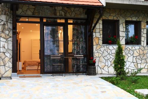 a glass door of a house with a patio at Apartman Andric 2 in Valjevo