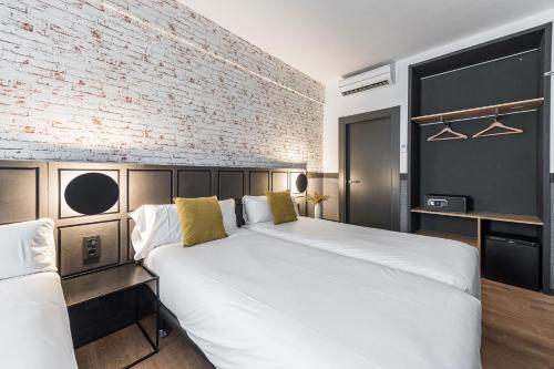 Letto o letti in una camera di BYPILLOW San Mamés
