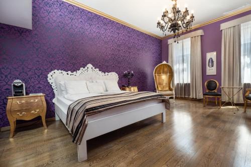Кровать или кровати в номере Soho Boutique Hotel