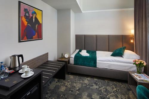 Ένα ή περισσότερα κρεβάτια σε δωμάτιο στο Hotel Estera