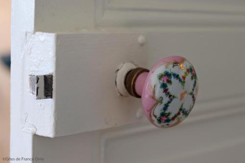 a close up of a door knob on a white door at Domaine des Thomins in Cisai-Saint-Aubin
