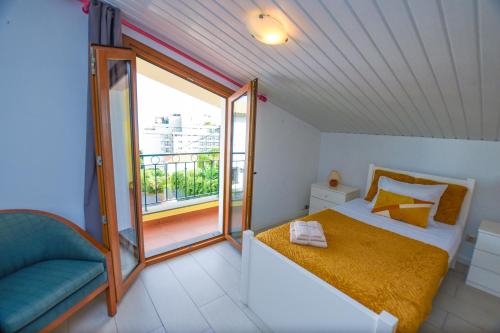 A bed or beds in a room at House near CR7 Museum