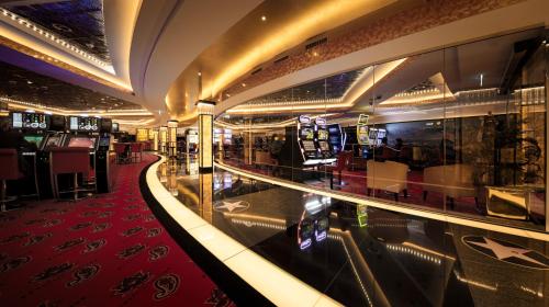 a lobby with a red carpet and a casino at Radisson Blu Hotel, St. Gallen in St. Gallen