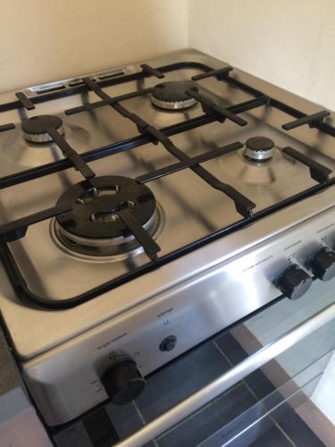 a stove top oven sitting in a kitchen at La Boulangerie in Romagny