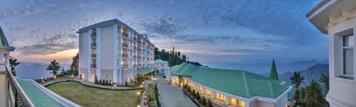 a rendering of a hotel with a view of a building at Club Mahindra Pristine Peaks Naldehra in Shimla