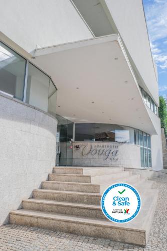 a building with a sign in front of it at Aparthotel Vouga in Termas de Sao Pedro do Sul