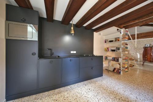a kitchen with a sink and a counter top at Apt Teatro in Venice