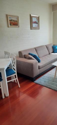 a living room with a couch and a table at Sweet Apartments in Žabljak