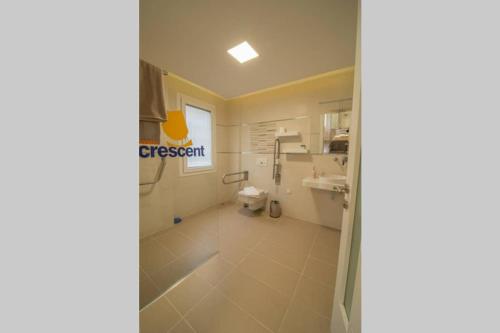 a bathroom with a shower and a sink at CRESCENT TWINS- BLUE VİLLA in Dalyan