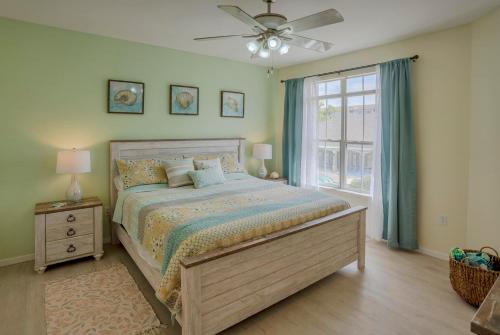 a bedroom with a large bed and a window at WFH Away from Home! FREE Wi-Fi and Parking, 4mi to Clearwater Beach in Clearwater