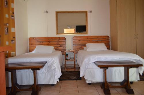 Ένα ή περισσότερα κρεβάτια σε δωμάτιο στο Zebra Guesthouse