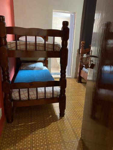 a couple of bunk beds in a room at Pousada J.C. Cazeri in Santos