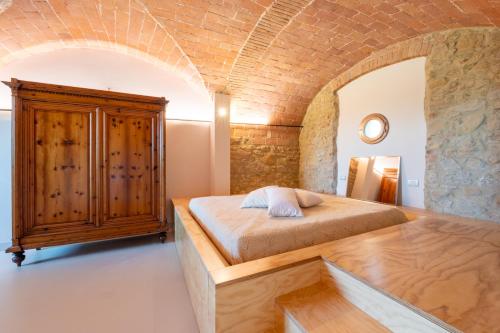 เตียงในห้องที่ Tognazzi Casa Vacanze - La Collina di San Gimignano