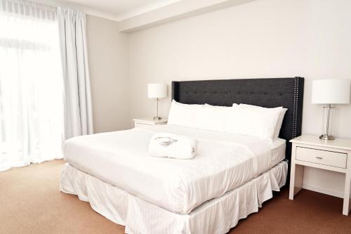 Ένα ή περισσότερα κρεβάτια σε δωμάτιο στο RiverRock Inn