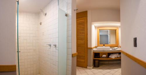 a bathroom with a shower and a sink at Hacienda Jurica by Brisas in Querétaro