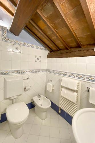 a bathroom with a toilet and a sink at Princess Art Hotel in Ferrara