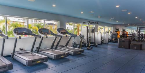 a gym with treadmills and elliptical machines at Margaritaville Resort Orlando in Orlando