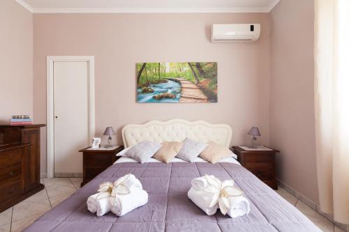 A bed or beds in a room at Casa Vacanze Giramondo