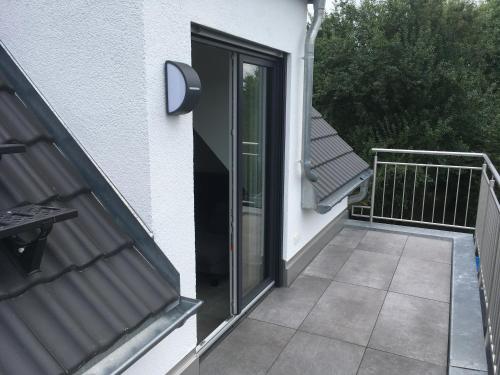 a sliding glass door on a balcony of a house at Zeitfrei-Apartments in Kirchheim unter Teck