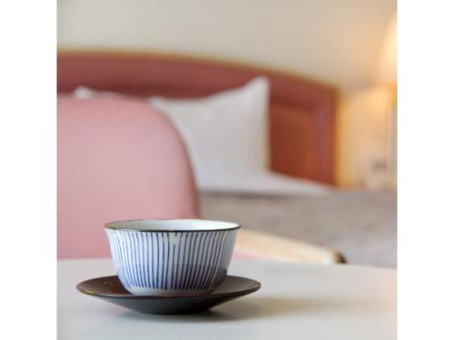 Tempat tidur dalam kamar di Hotel Ajour Shionomaru - Vacation STAY 92336