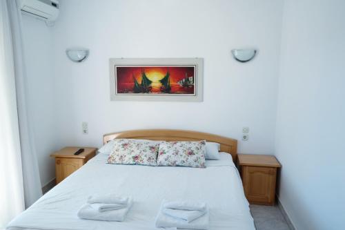 a bedroom with a bed with two pillows on it at Apartments gabrijel in Vodice