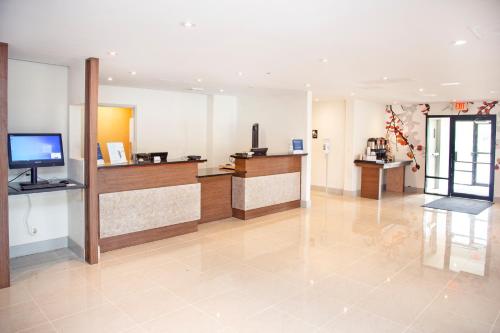 a lobby with a reception desk in a hospital at Extended Stay America Suites Springfield in Springfield