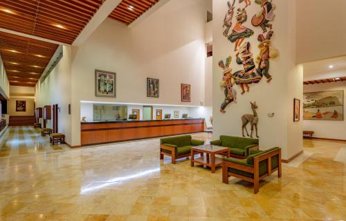 a hospital lobby with chairs and a waiting room at GHL Hotel Lago Titicaca in Puno