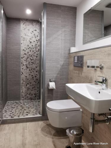 Ένα μπάνιο στο Appartement im Stall "Lune River Ranch"