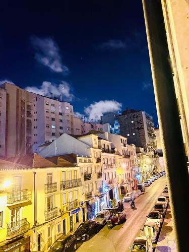 a view of a city street with buildings and cars at Sri-Indo Guest House in Lisbon